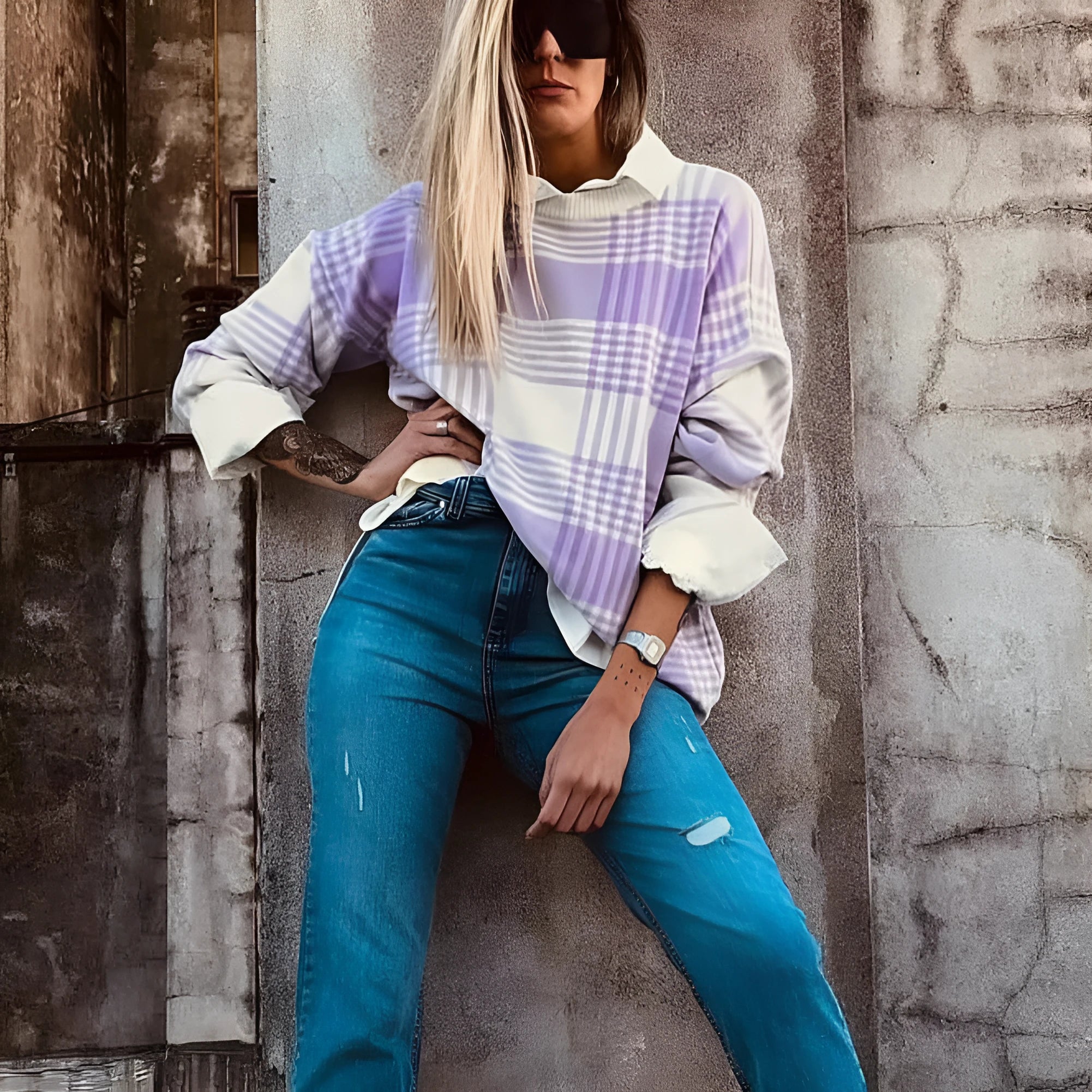Lilac plaid print loose sweater with long sleeves and ribbed cuffs.