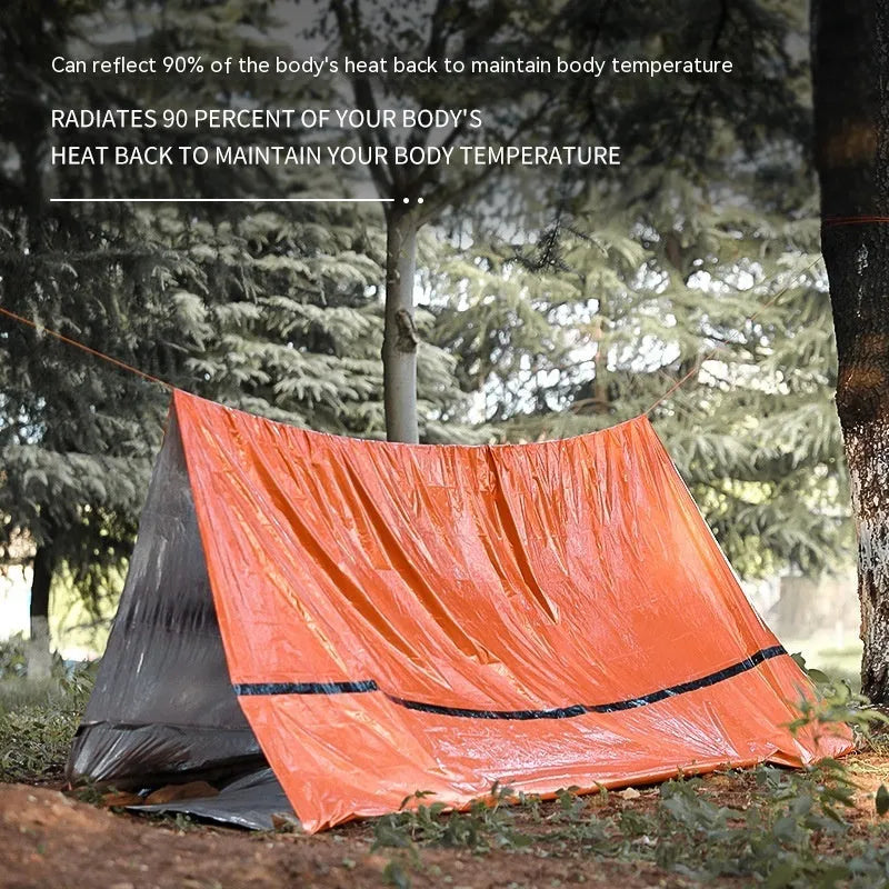 Orange disaster relief tent with sleeping bag and raincoat emergency package