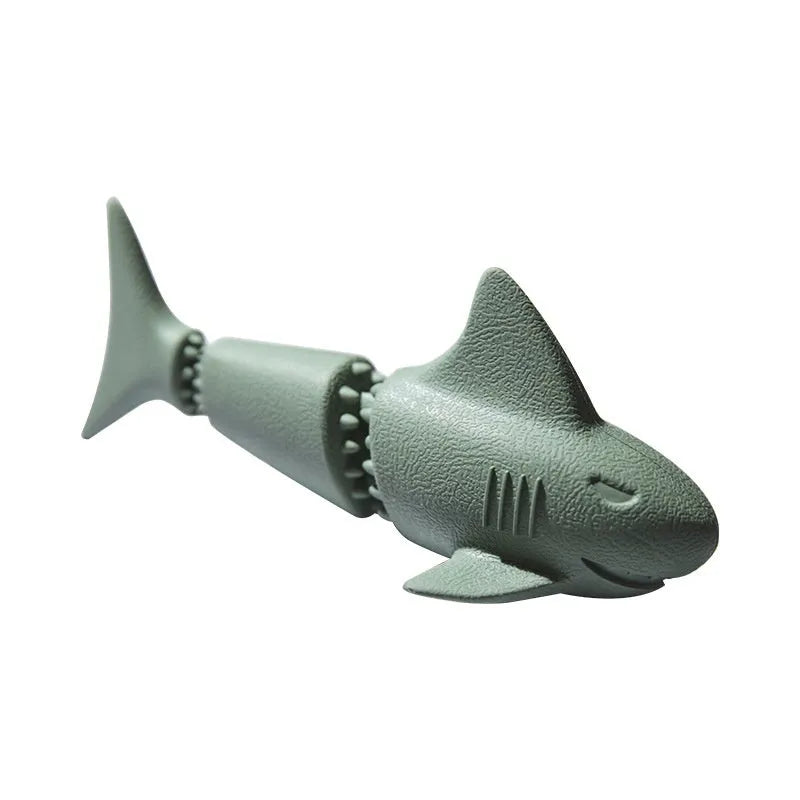 Blue and green deep sea shark, conch, and starfish-shaped rubber dog toys for food leakage and interactive play.