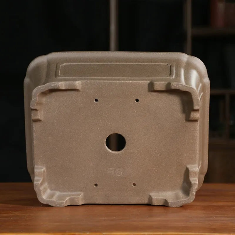 Antique rectangular purple sand clay bonsai pot on a floor, shown in two size options.