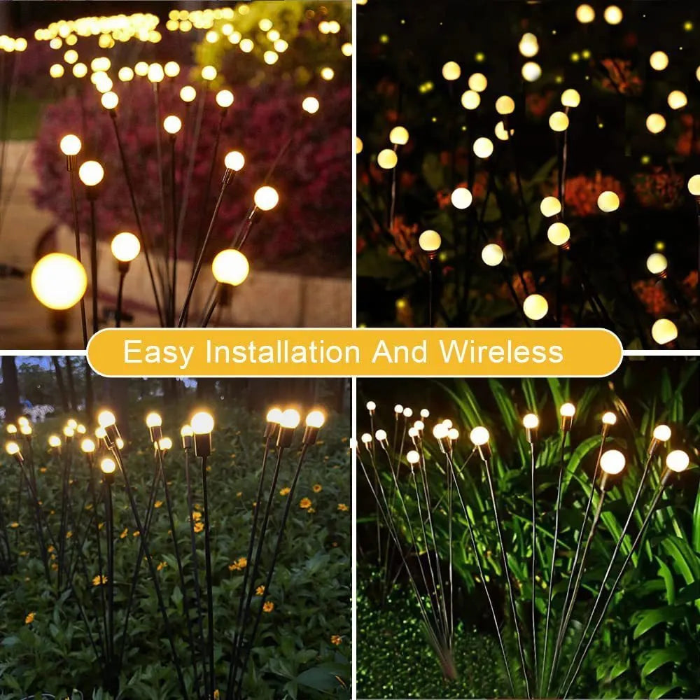 Solar-powered LED pneumatic firefly ground stake light with multiple heads on a grassy lawn.