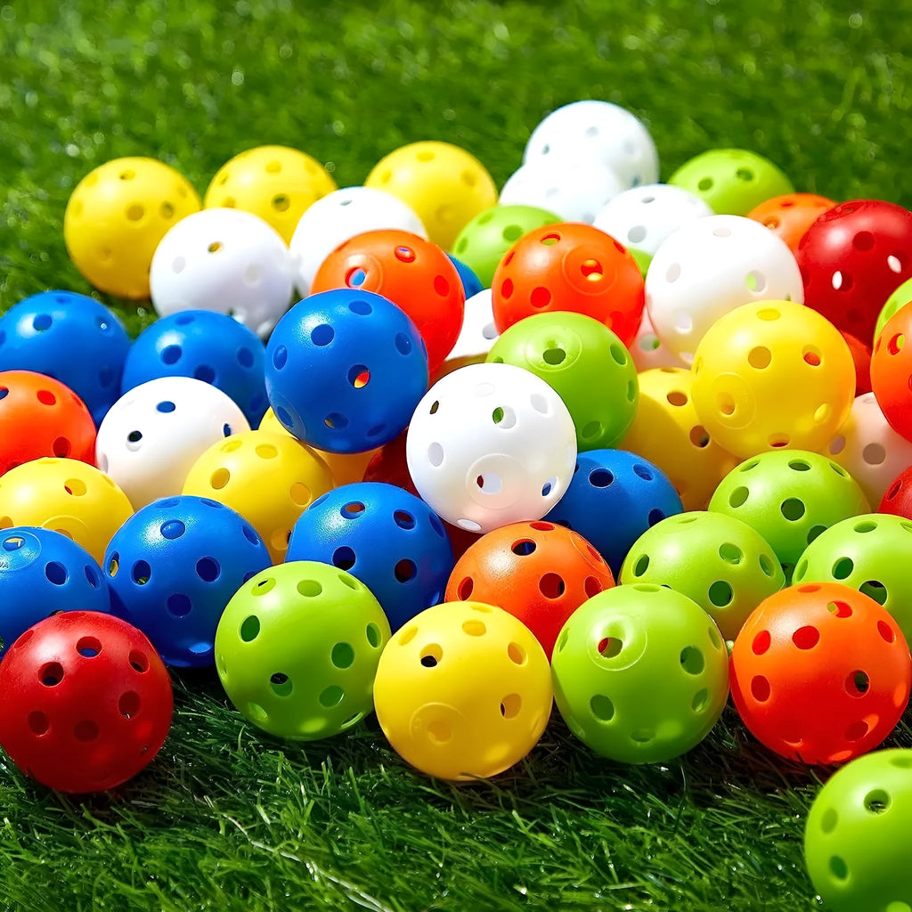 Assortment of red, orange, blue, green, white, and yellow 26-hole golf practice balls in a net bag.