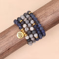 Blue multi layer bracelet with patterned network stone beads on alloy strands