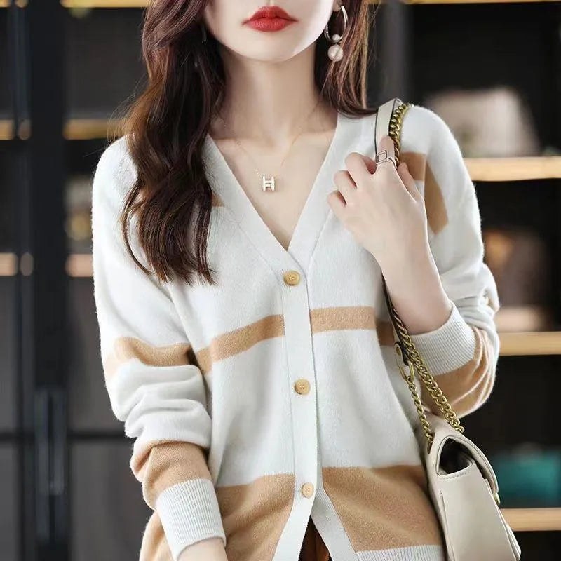 Women's slim fit striped V-neck knitted cardigan in a 3D pattern on a hanger.