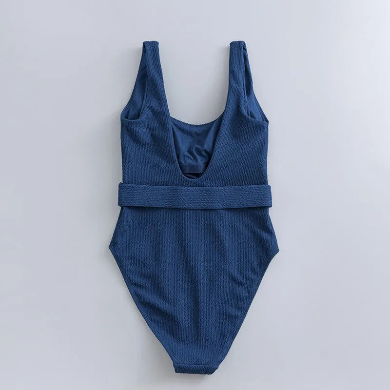 Navy blue women's one-piece sleeveless swimsuit with triangle neckline and slim-fit design.