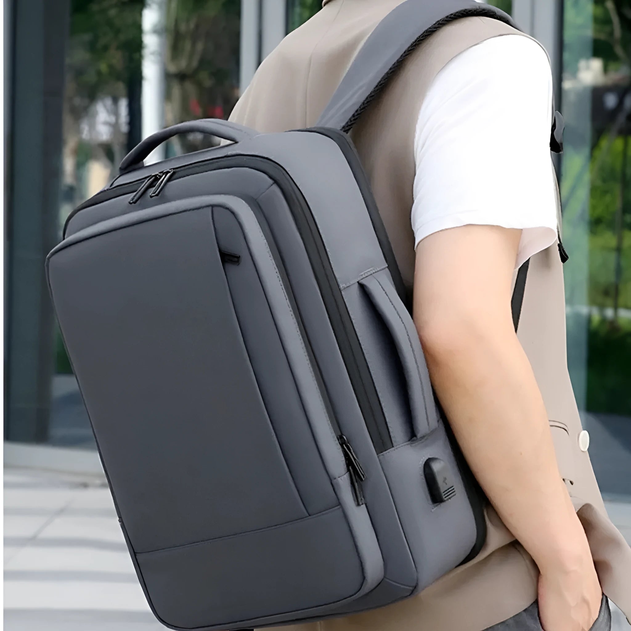 Men's large capacity waterproof backpack in black with curved shoulder straps