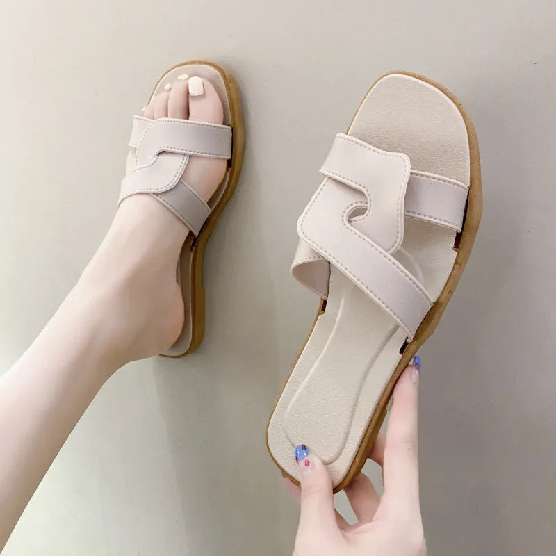 Women's PVC cross-strap toe ring sandals in light blue on a white background.