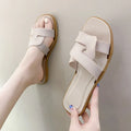 Women's PVC cross-strap toe ring sandals in light blue on a white background.