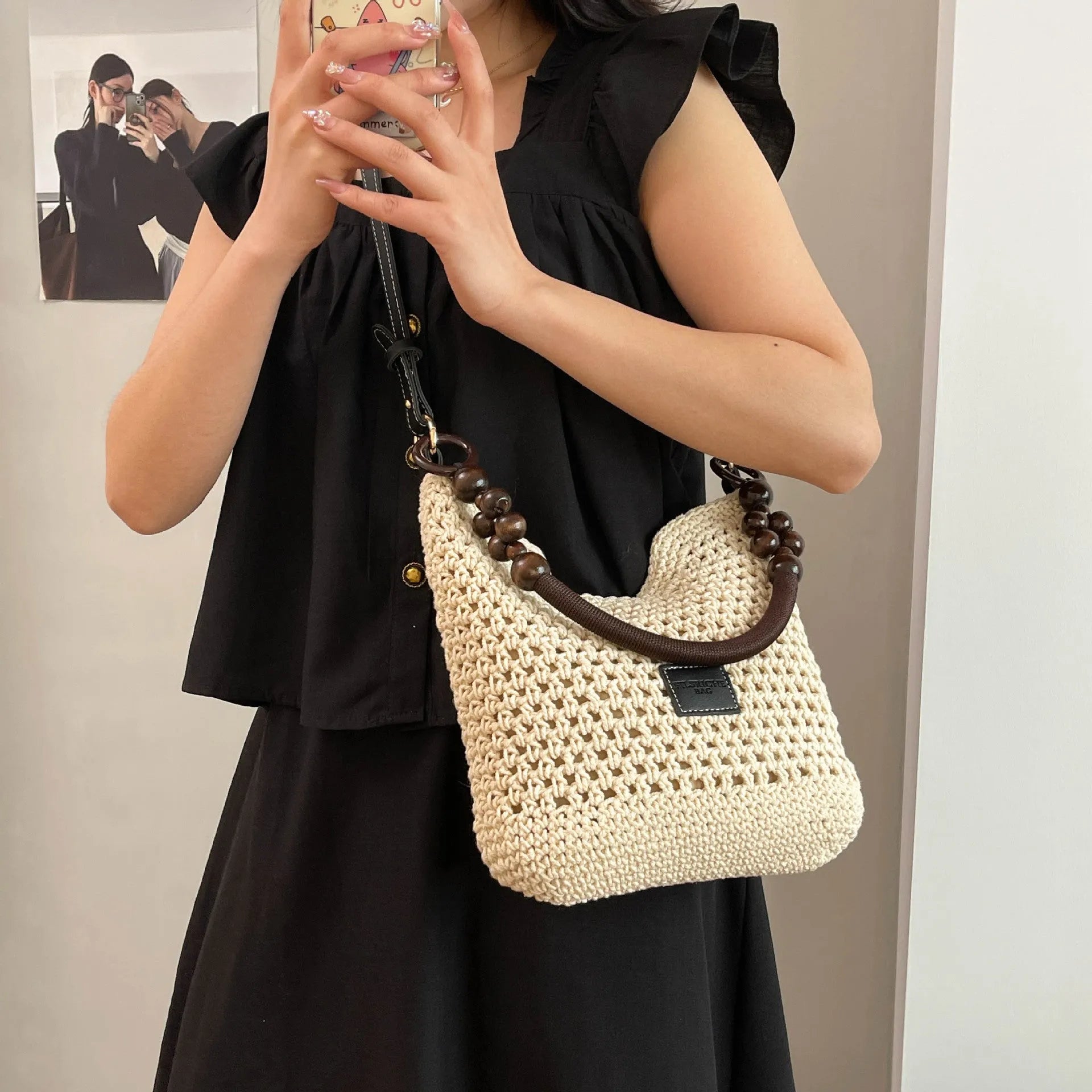 Large knitted tote beach bag with bucket shape and contrast stitching in black or brown colour options