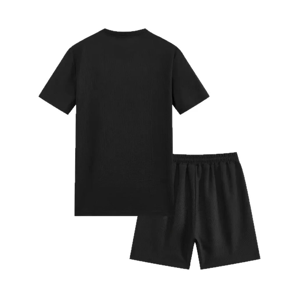 Man wearing a white waffle texture short sleeve blouse and matching shorts summer set.