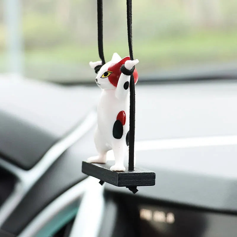 Cartoon-style resin cat pendant for car interior decoration in one of five colour options.