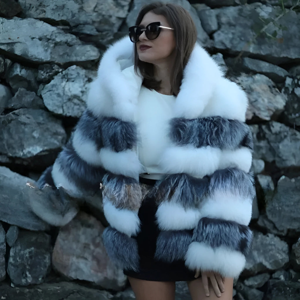 Loose-fitting women's hooded coat in artificial fur, shown in brown and silver fox colours.