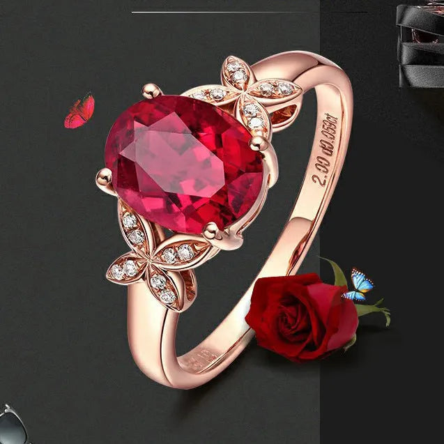Women's butterfly and heart-shaped ring in copper with rose gold plating shown in red and blue colour options