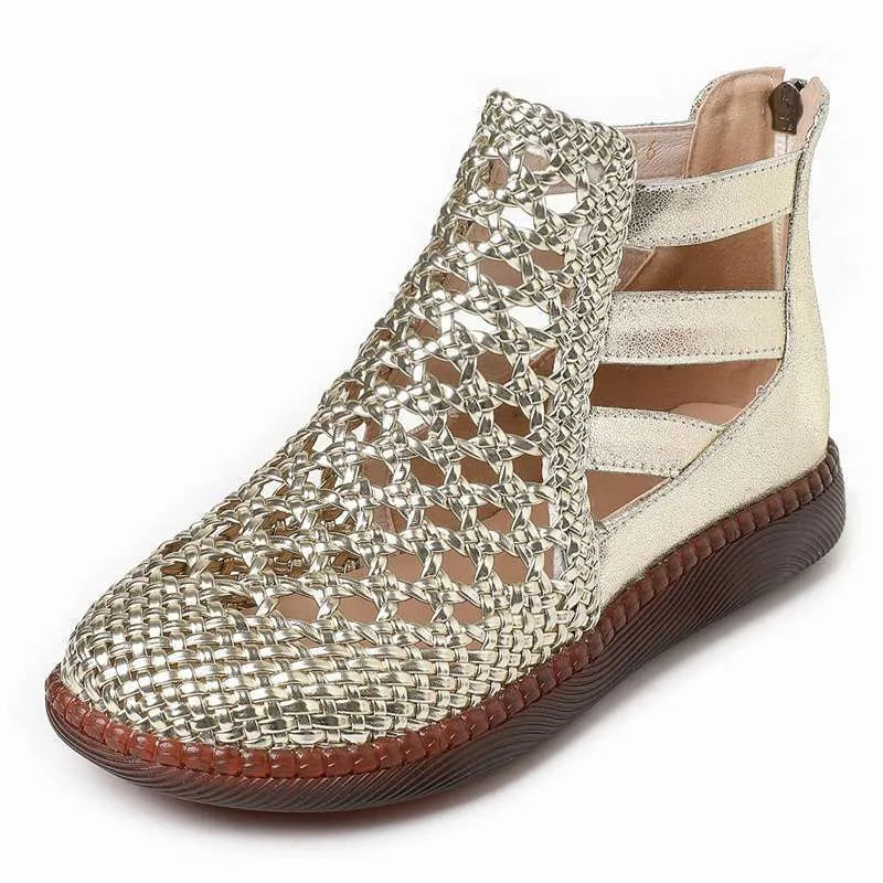 Women's flat gold sandals with hollow-out design and soft sole.