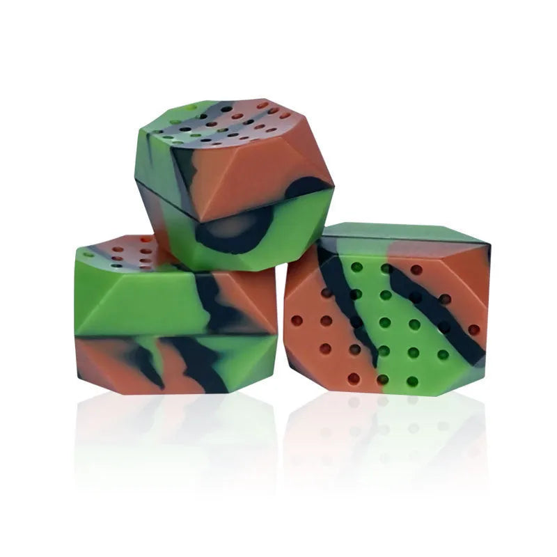Two silicone camouflage-style facial muscle fitness balls for jaw training in transparent boxes.