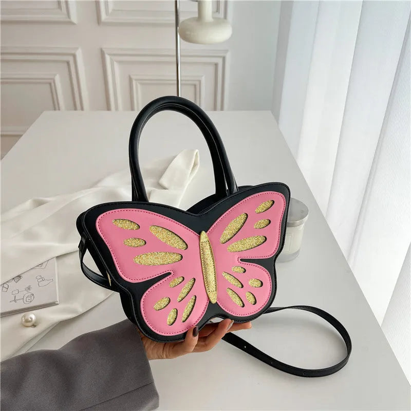 Small square PU leather crossbody shoulder bag in black with contrast trim, shown from the front.