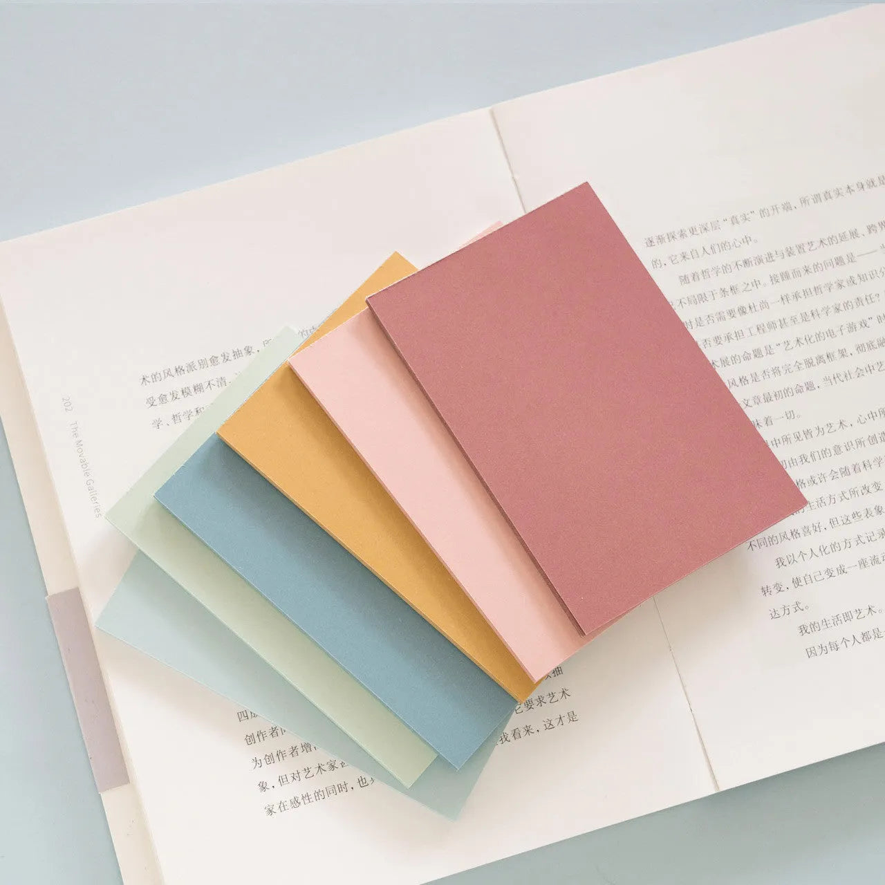 Large red and multicolour post-it notes showing 12cm by 8cm dimensions and adhesive strip