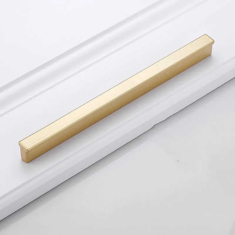 Gold aluminium alloy T‑shape single hole cabinet door handle.