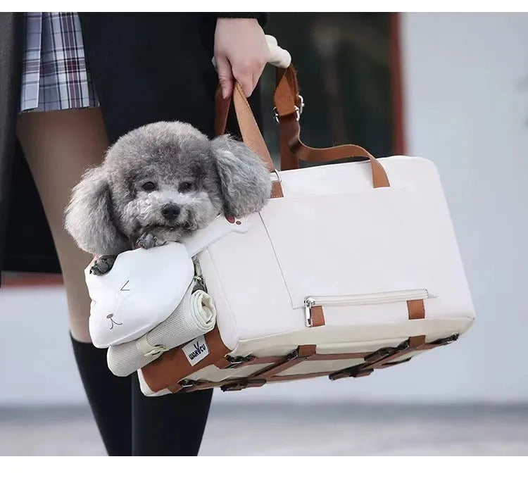 Beige hard-sided pet flight case with one shoulder strap, dimensions 43x25x22.5cm.