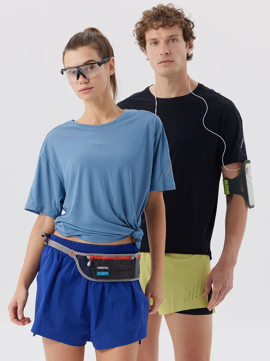Man wearing black side-slit nylon sports shorts on a casual summer day.