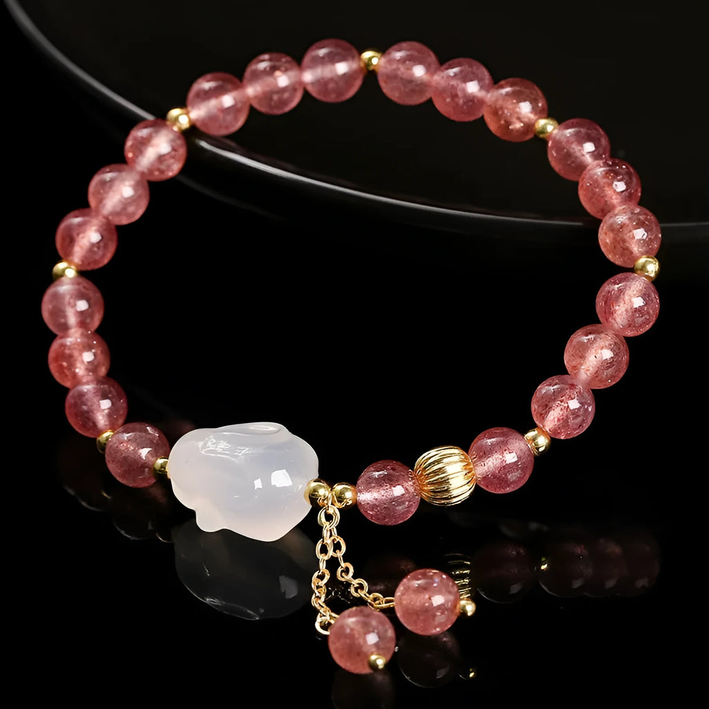 Women's white rabbit bracelet with 6mm round strawberry quartz agate beads in a geometric pattern.