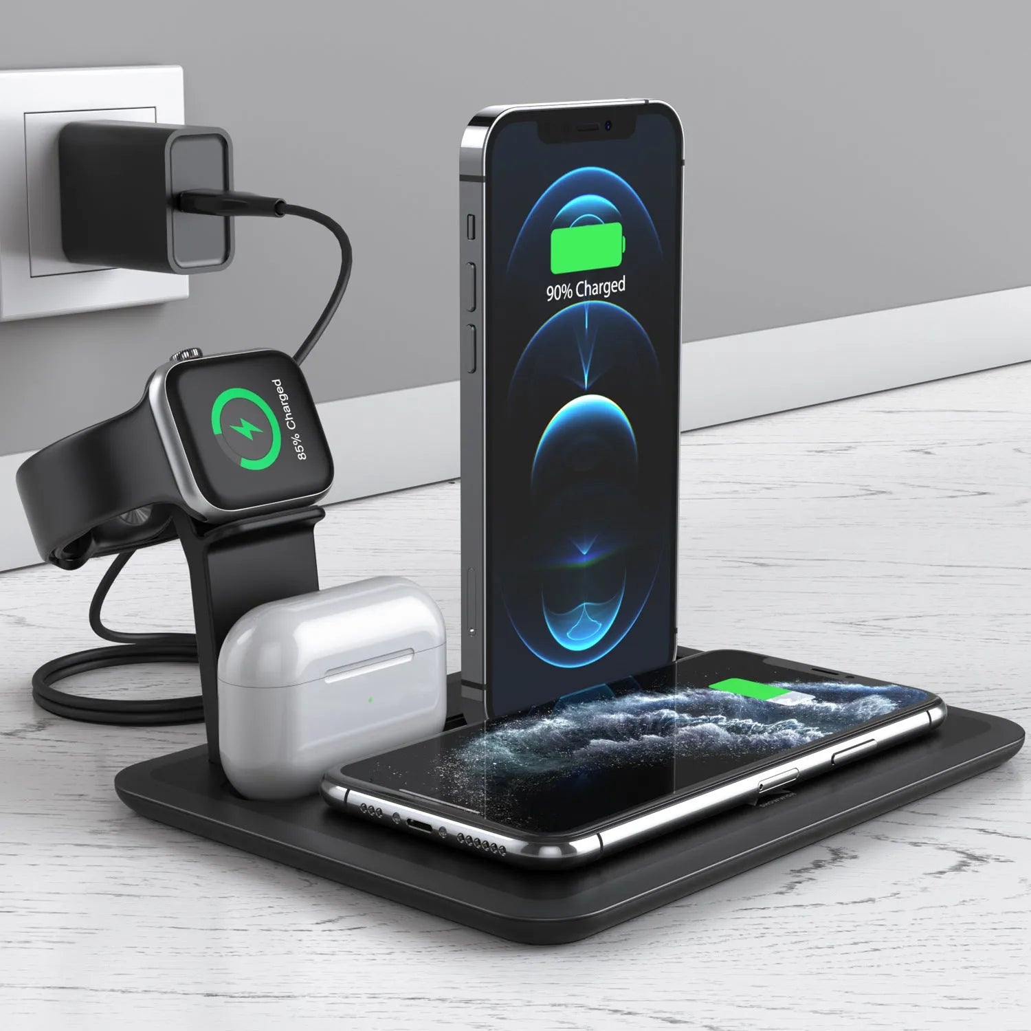 Black multi-device wireless charging station for phone, smartwatch, and headphones on a wooden desk.