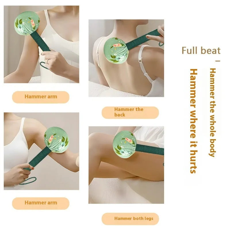 Argy wormwood hand-held massage hammer in green colour on a 26cm scale.