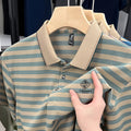 A man wearing a blue mosaic striped short sleeve polyester t-shirt, showcasing the casual fit.
