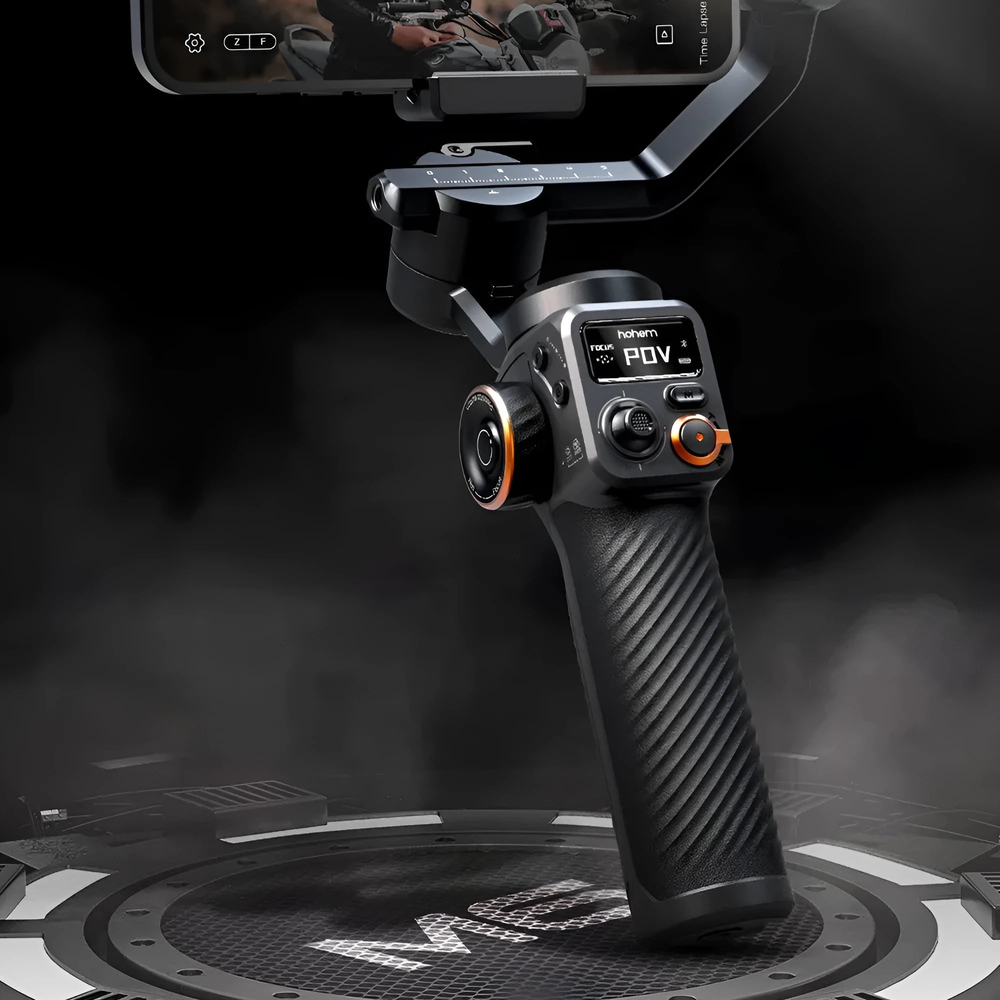 Black smartphone gimbal stabiliser with AI fill light and tripod on a table