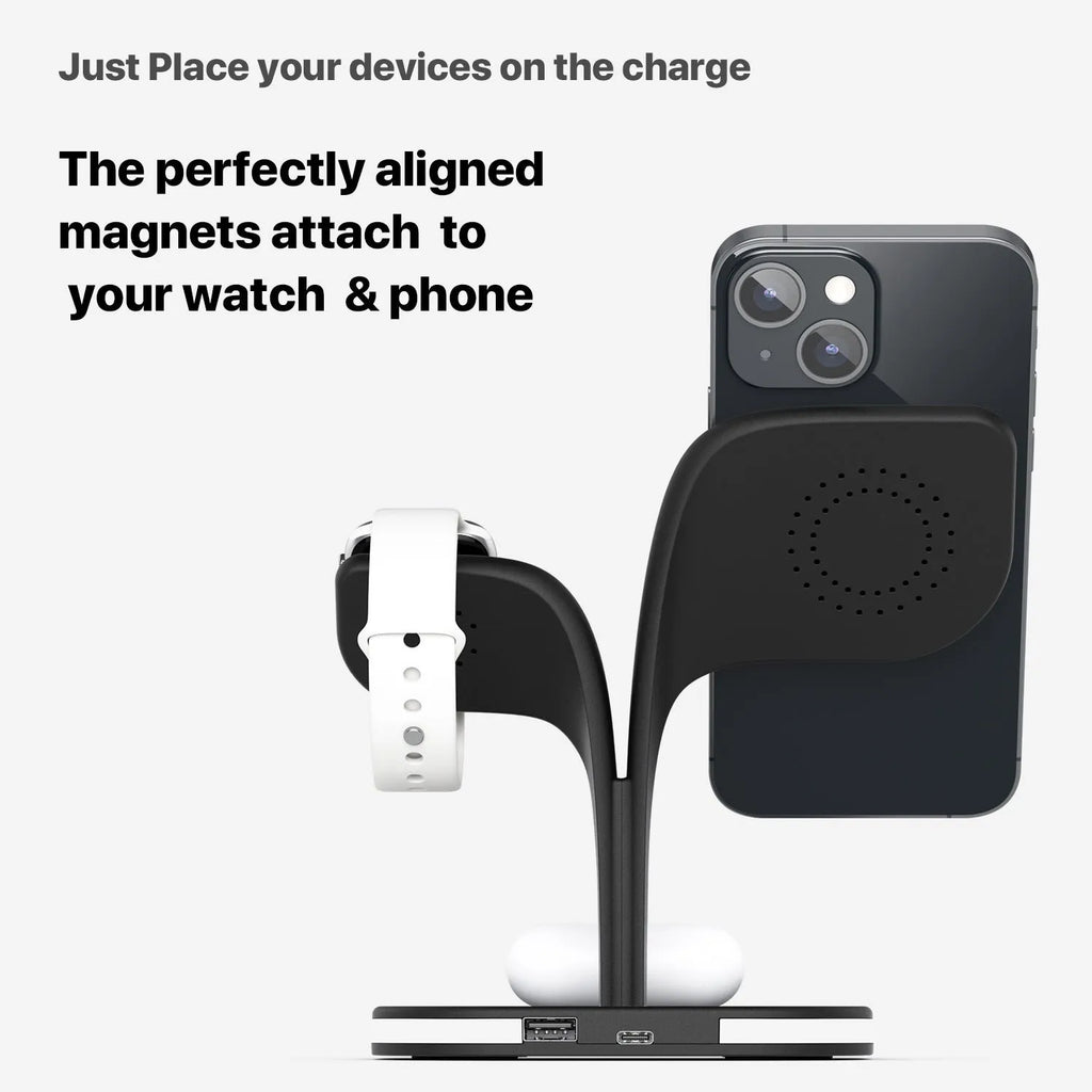 Black wireless charging station on desk with phone, watch, and headphones charging simultaneously