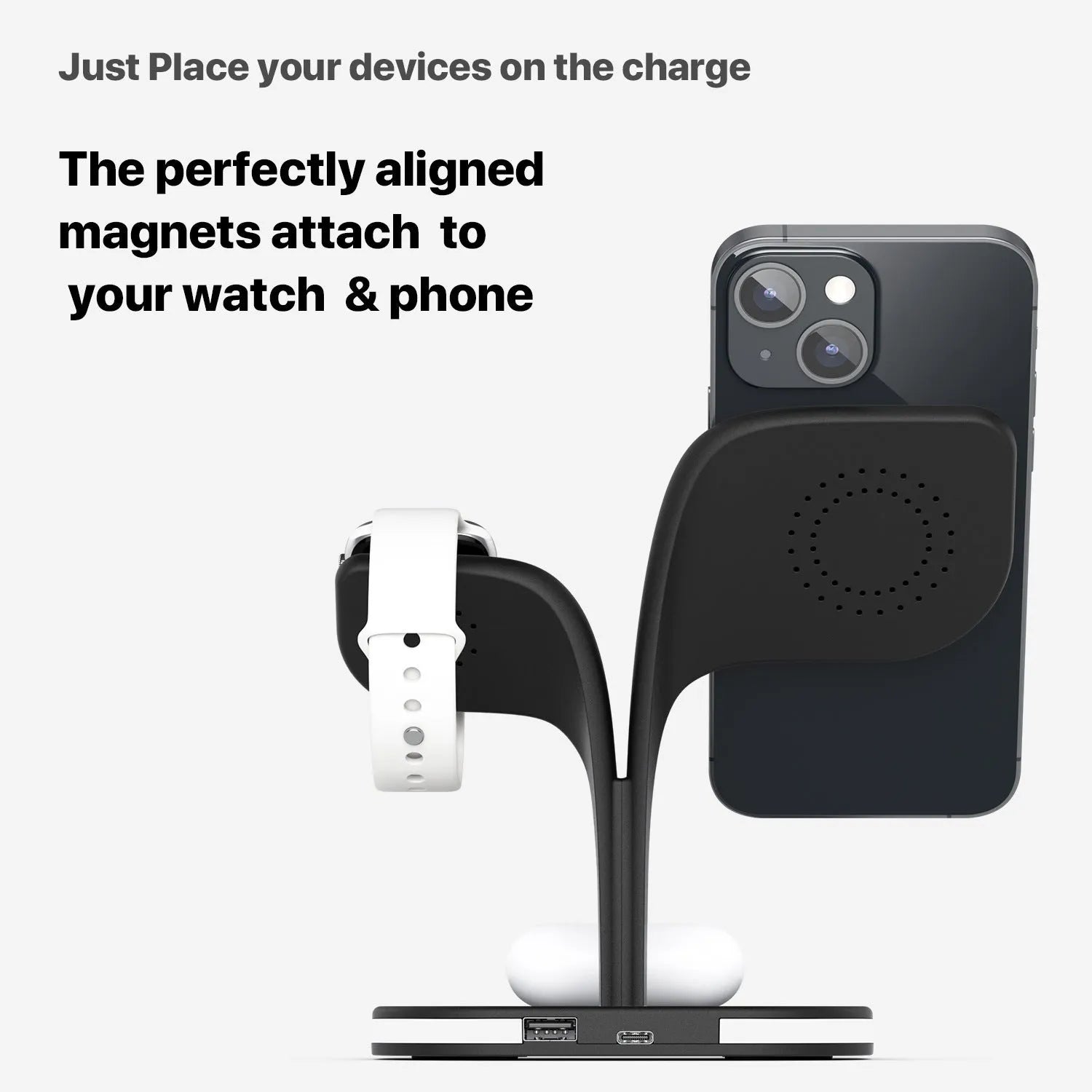 Black wireless charging station on desk with phone, watch, and headphones charging simultaneously