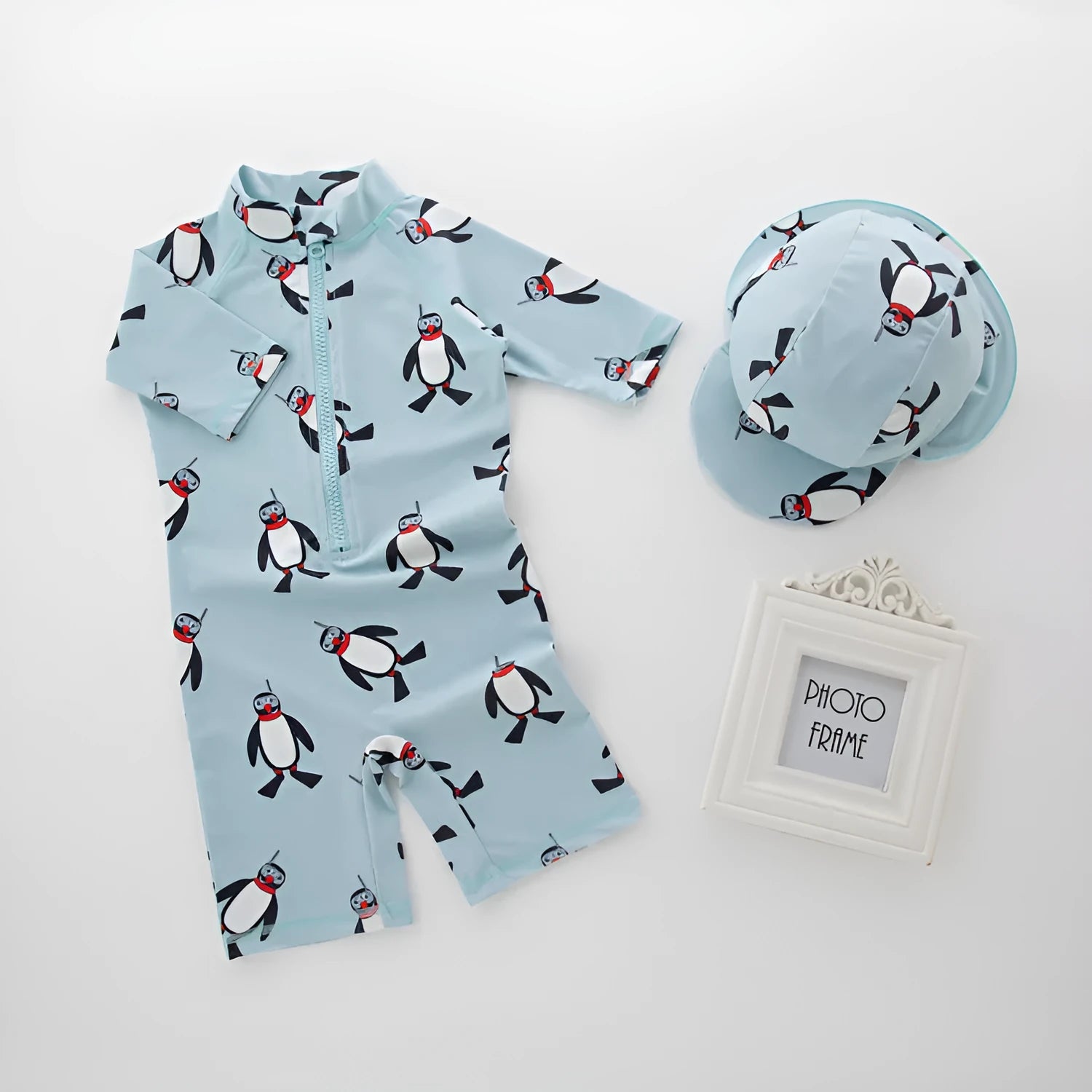 Boy's penguin print long sleeve one-piece swimsuit with matching swimming cap set