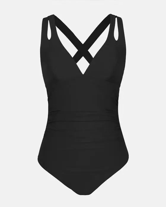 Solid colour one-piece bikini swimsuit with cross shoulder straps on a mannequin
