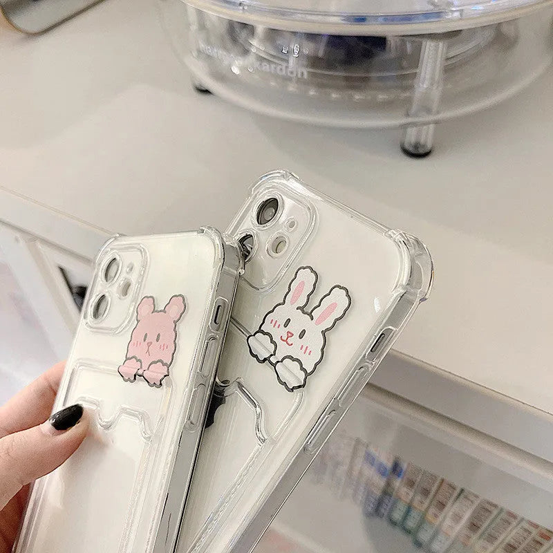 Cartoon design transparent iPhone case with card holder slots on the back.