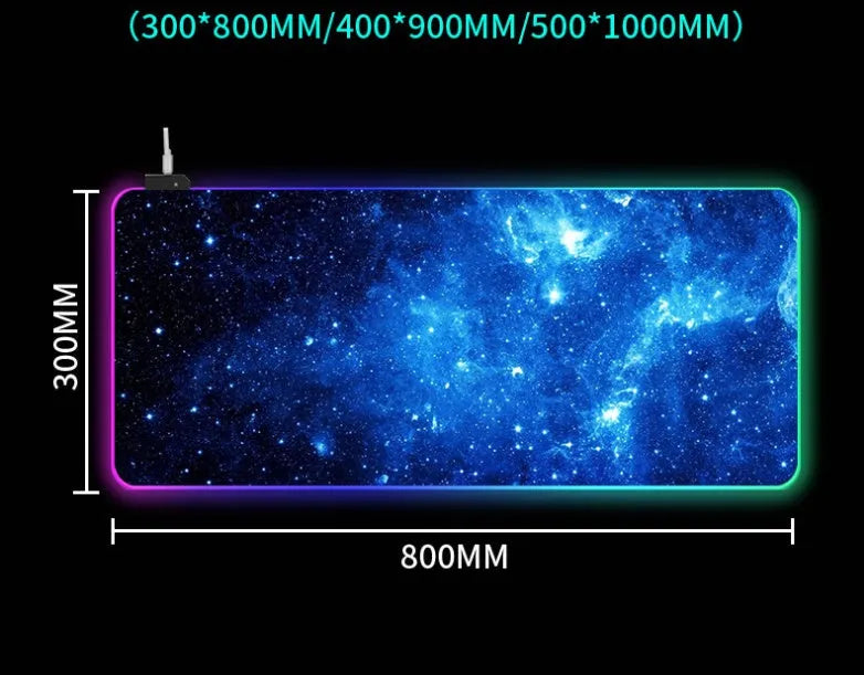 Symphony RGB luminous gaming mouse pad with starry sky pattern on a desk, showing USB cable.