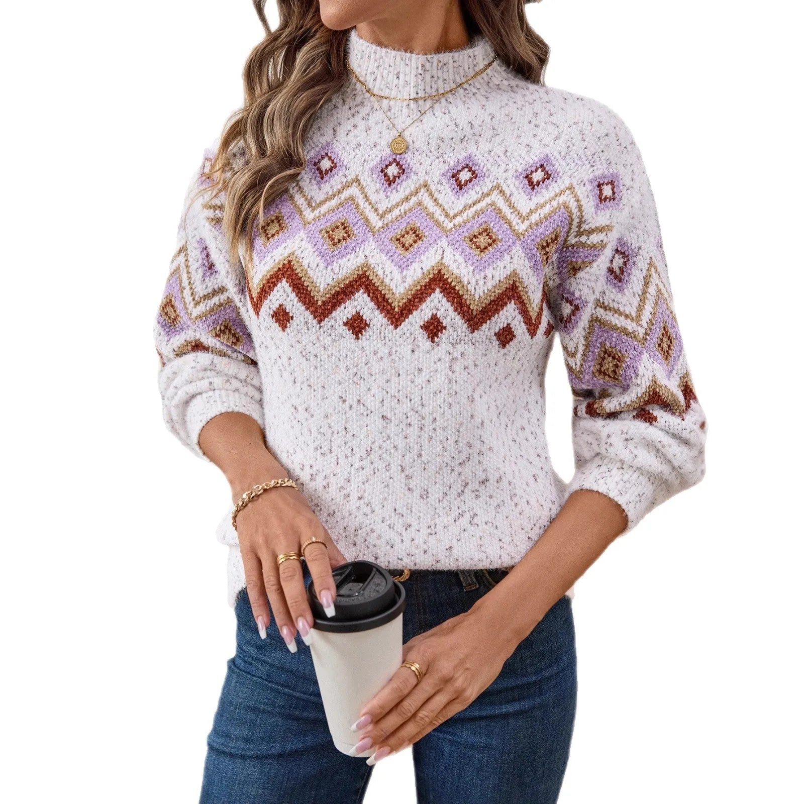 White geometric jacquard half turtleneck loose fit sweater on a hanger, showing long sleeves and textured fabric.