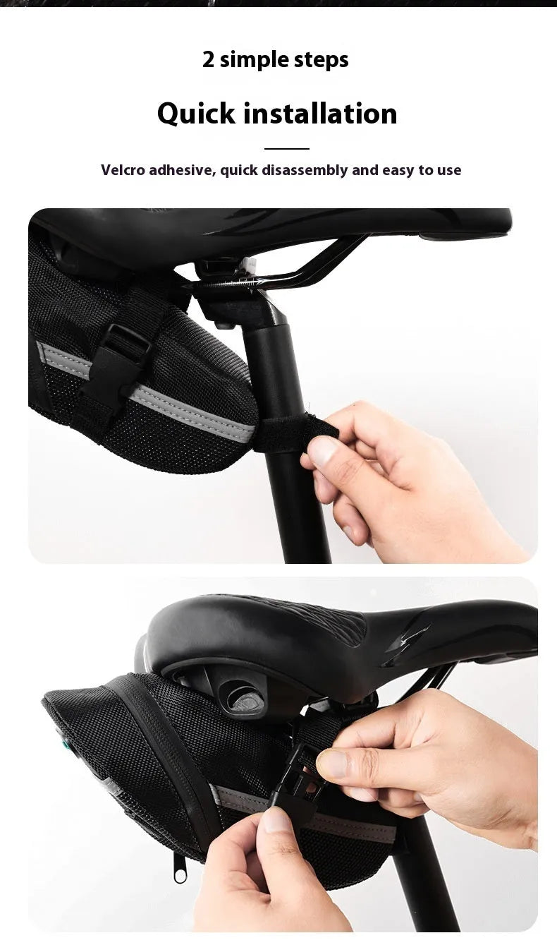 Black cycling tail bag mounted on mountain bike saddle with quick release fixture