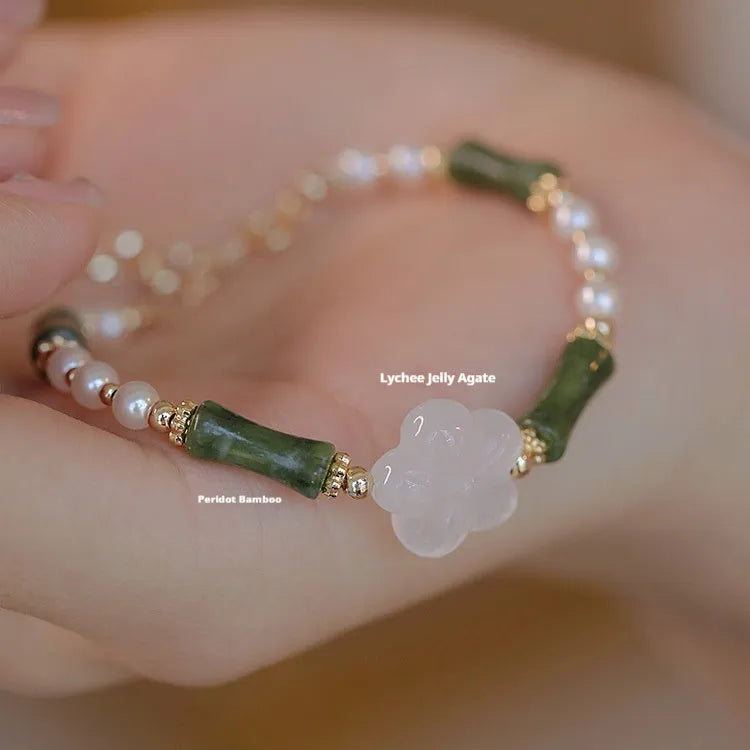 Chinese style women's bracelet with Hetian jade, bamboo joint design, and 4mm shell pearl components