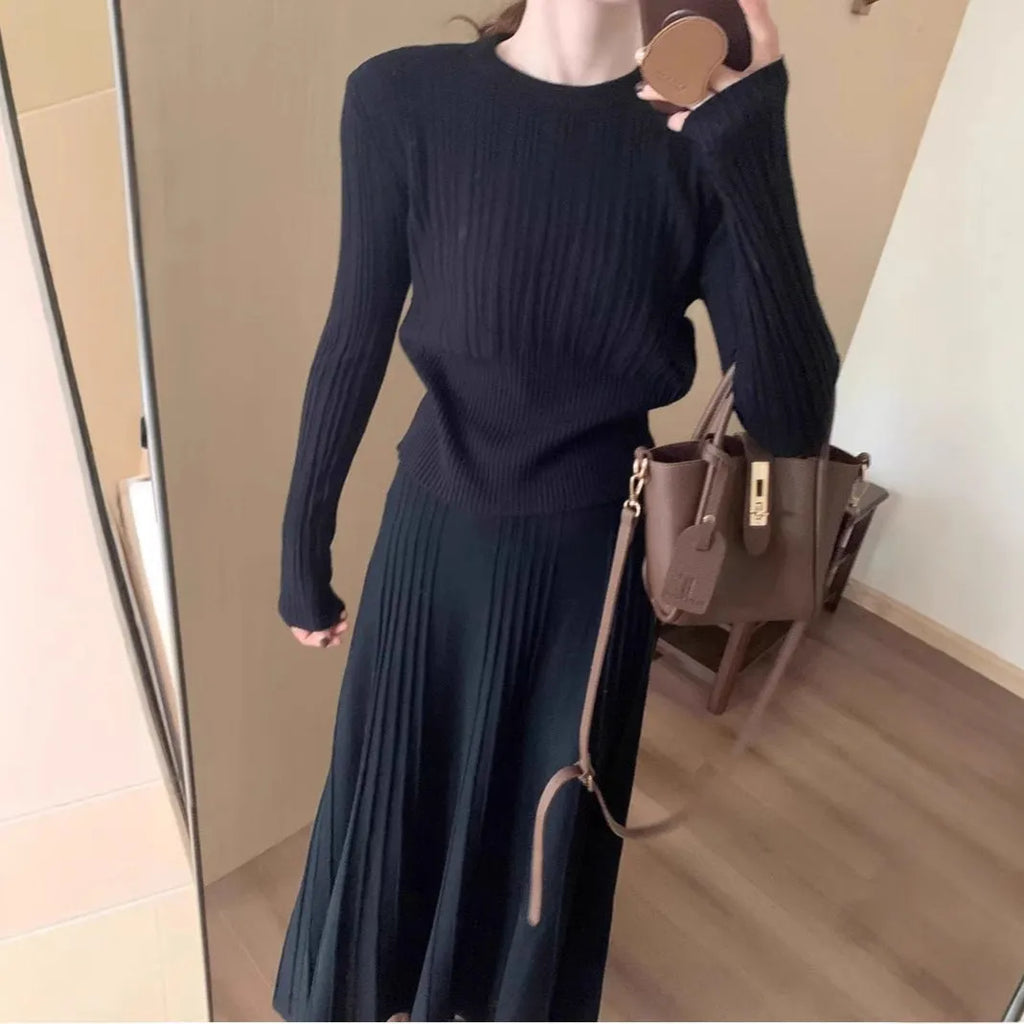Dark grey knitted ethnic style dress suit with black collage stitching and matching skirt.