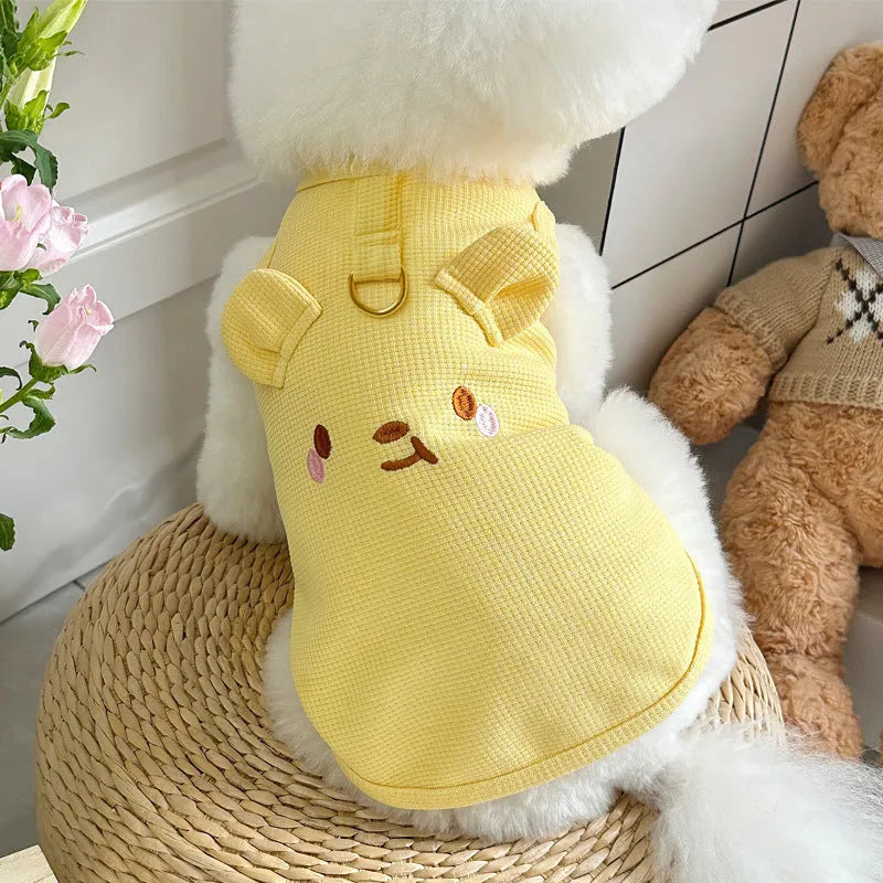 Yellow waffle weave polyester dog vest shown on a small dog, demonstrating its casual fit and textured fabric.