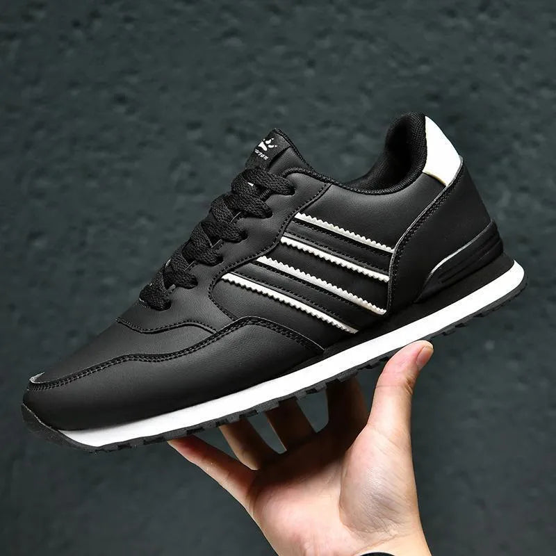 Black men's sports casual leather shoes with a carved wing pattern and a super high heel.