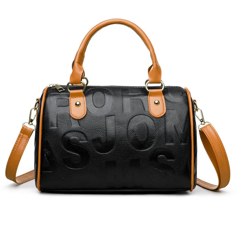Brown cylindrical PU leather crossbody bag with three shoulder straps showing interior polyester lining
