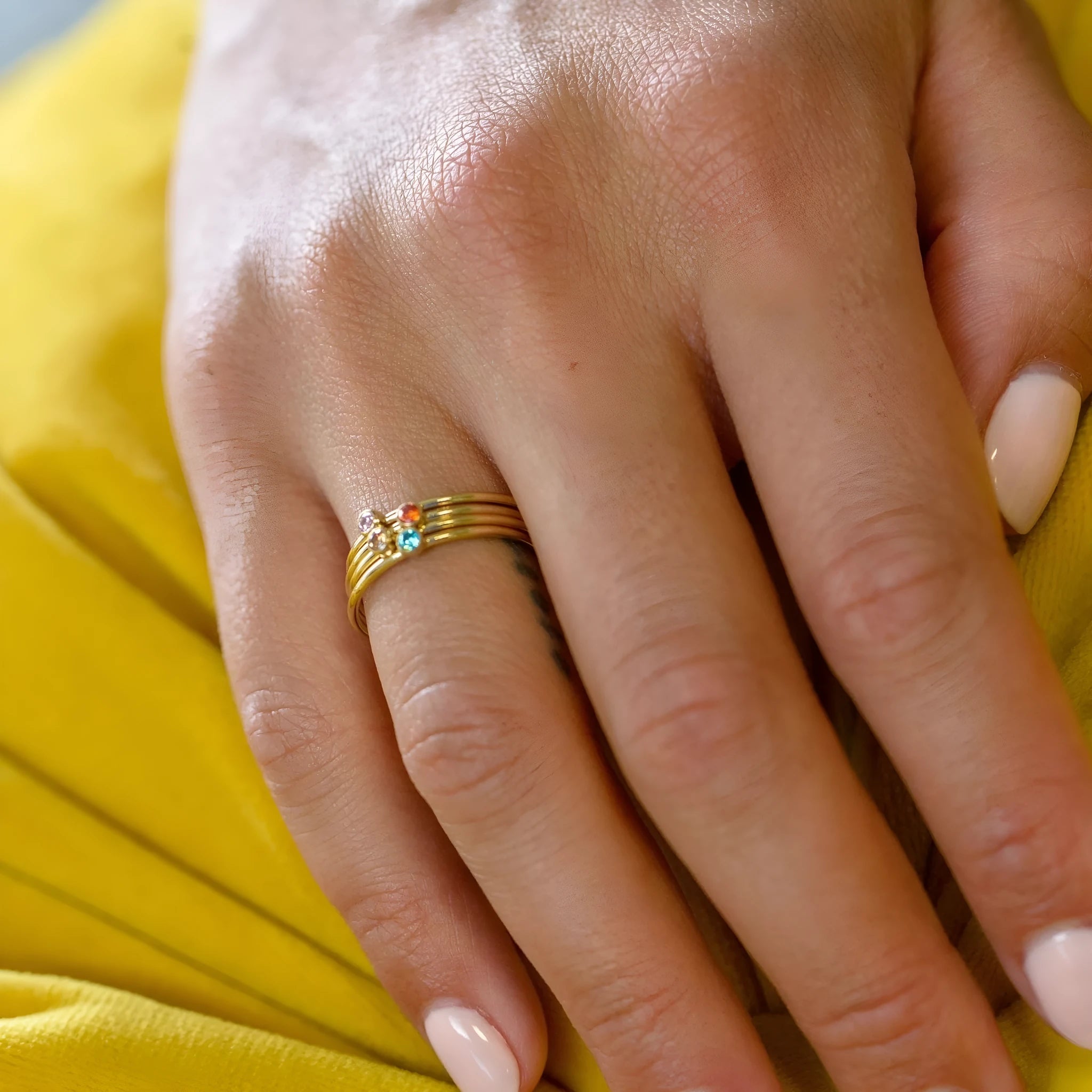 Geometric titanium steel ring with engraved December birthstone design on a white background.