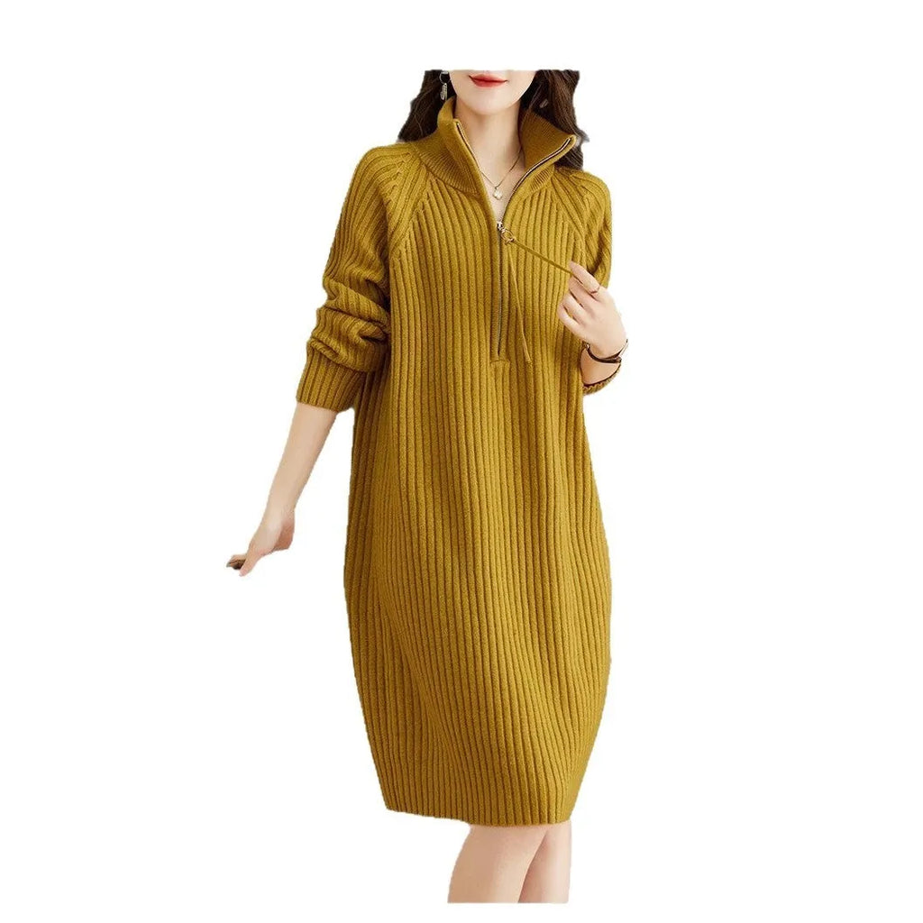 Beige half-zip woolen skirt with stand collar and long sleeves in a loose, straight dress cut.