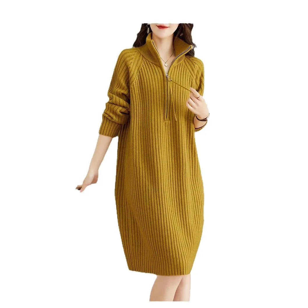Beige half-zip woolen skirt with stand collar and long sleeves in a loose, straight dress cut.