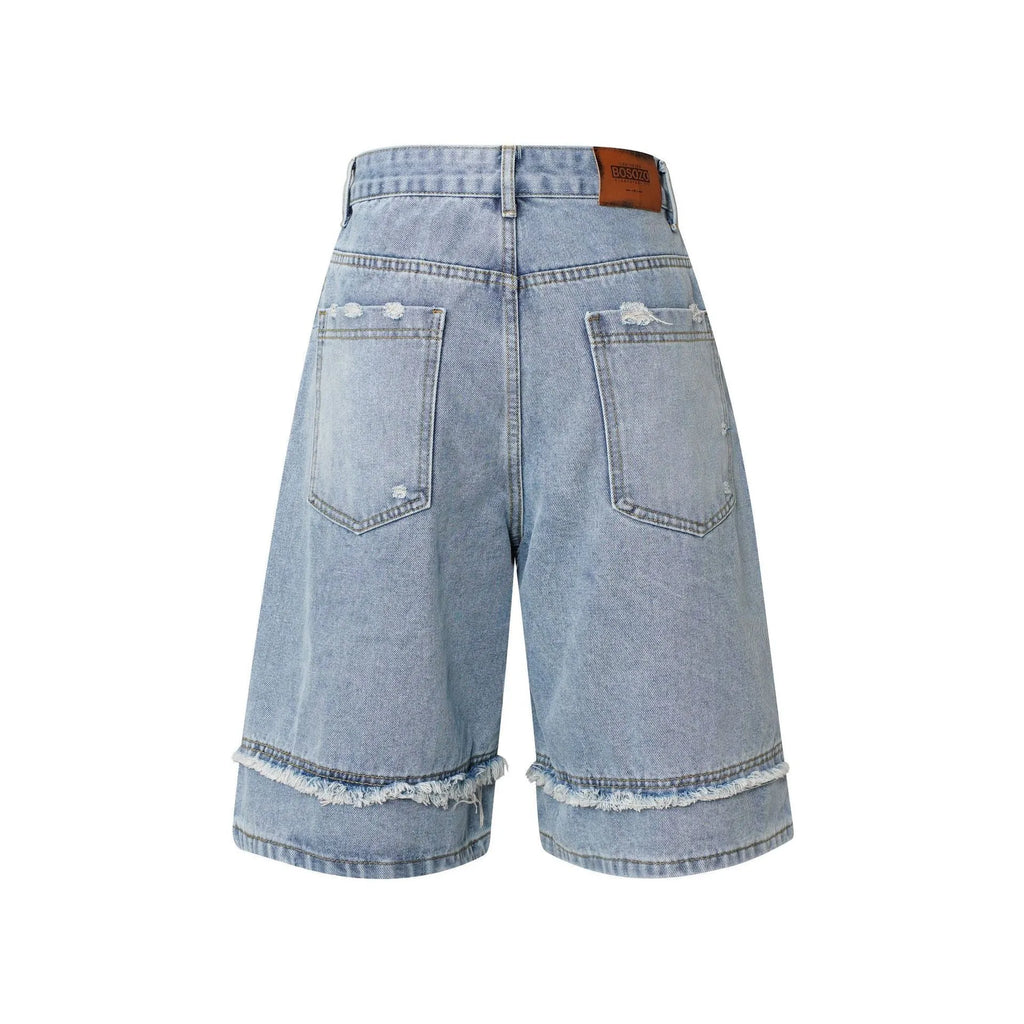 Pu Shuai men's distressed raw edge denim shorts in straight leg cropped cut on a solid background