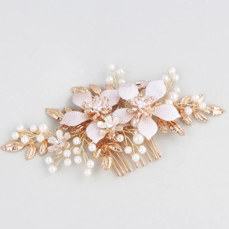 Gold bridal hair comb with pearl and white crystal flower design on head