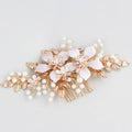 Gold bridal hair comb with pearl and white crystal flower design on head