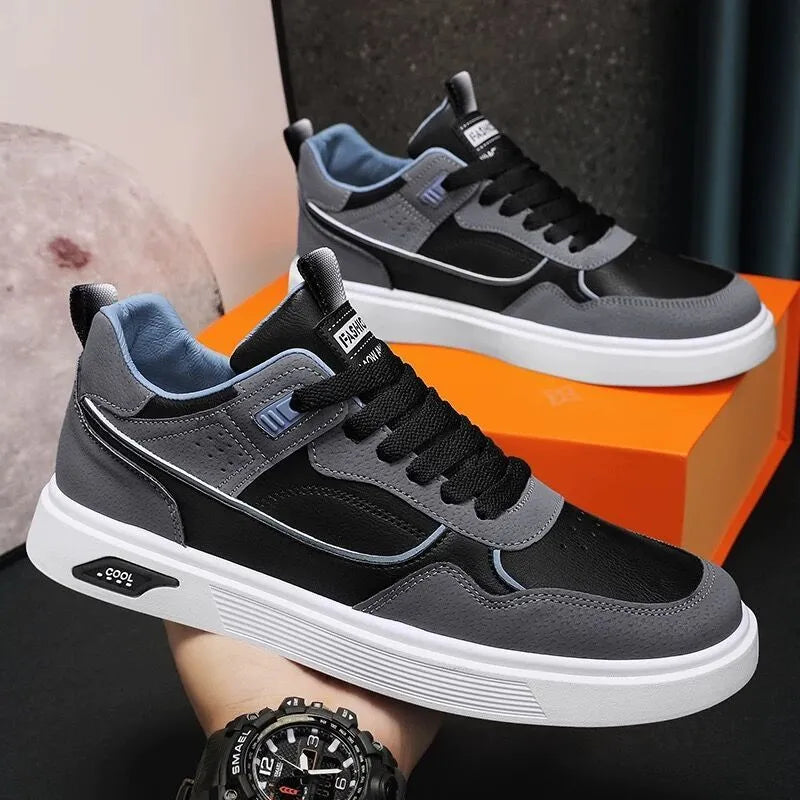 Men's solid-colour canvas board shoes with leather stitching and mesh lining.