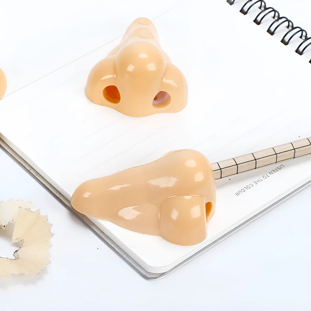 Flesh colour plastic manual pencil sharpener with geometry shape measuring 58x45x30mm